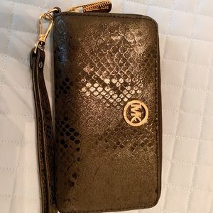 Black MK wristlet with gold accents.